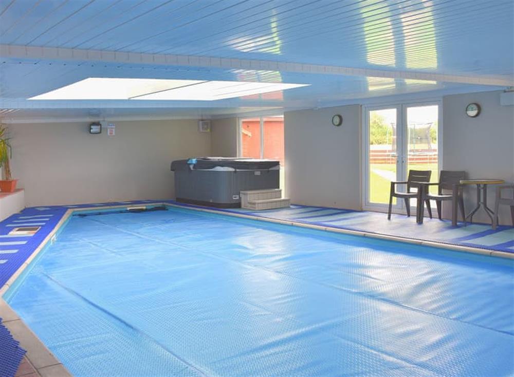 Indoor heated swimming pool and hot tub at Ashdene Cottage in South Marston, Wiltshire