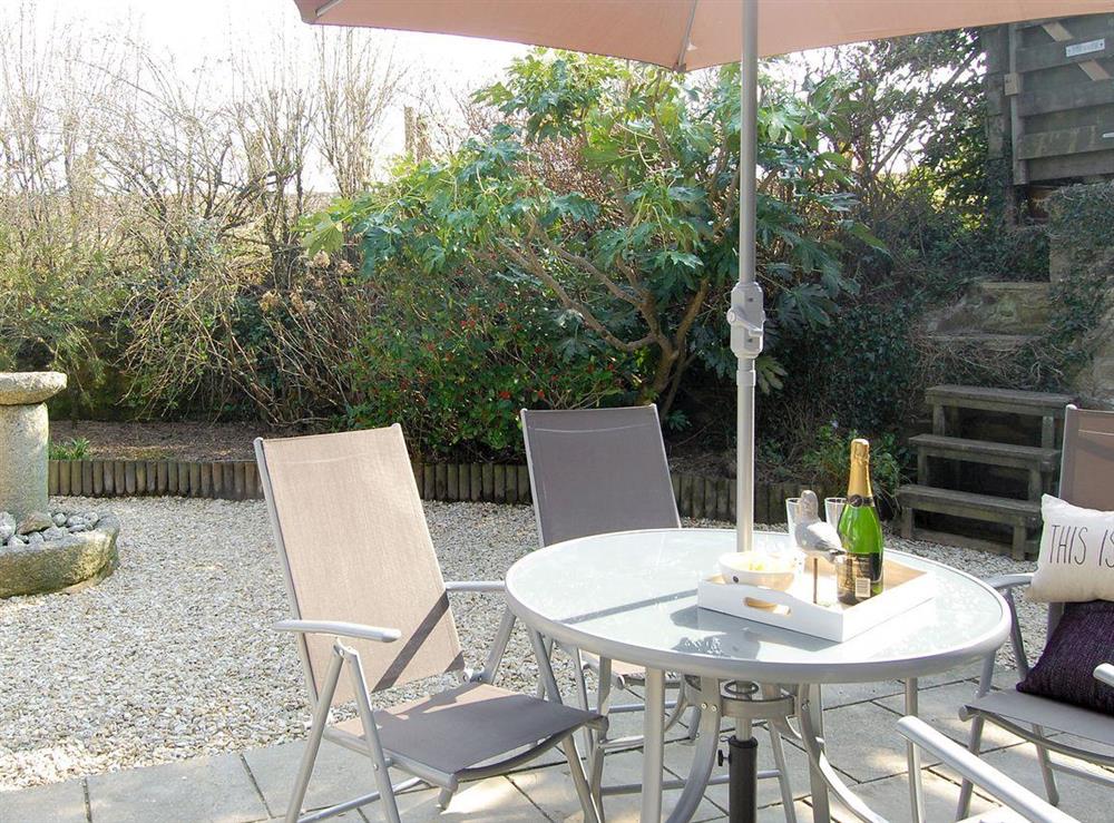 Private enclosed patio-style rear garden at The Court, 