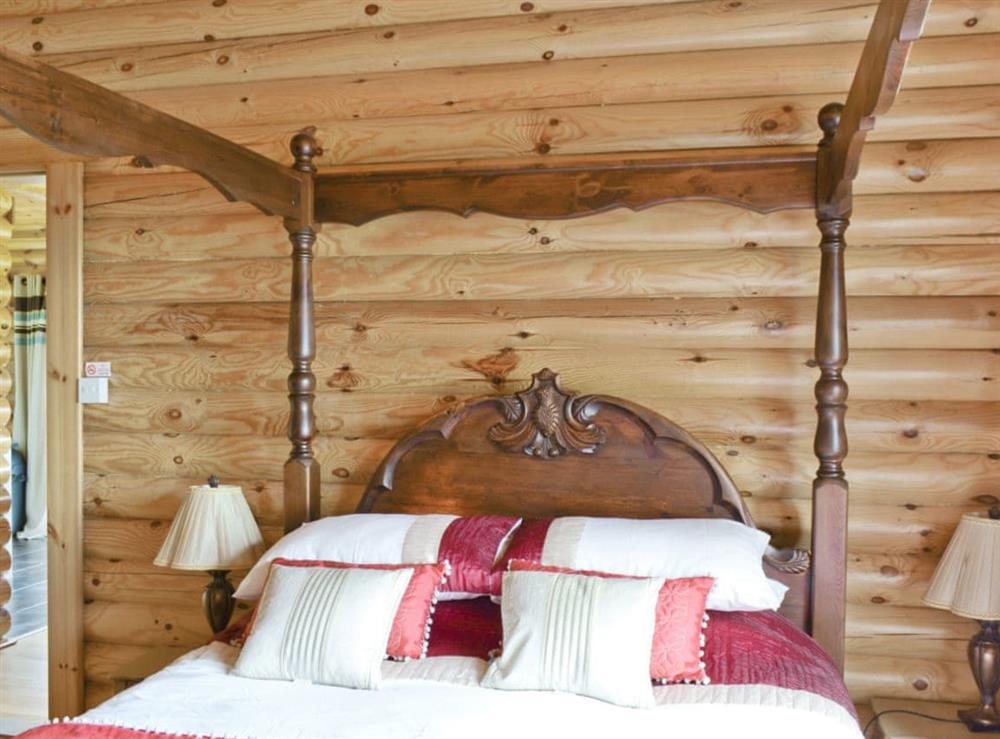 Four Poster bedroom at Ashknowe Log Cabin in Perth, Perthshire