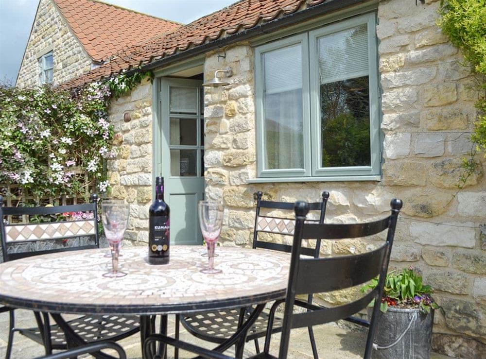 Patio area with outdoor furniture at Ashpit Cottage in Little Barugh, near Pickering, N. Yorks., North Yorkshire