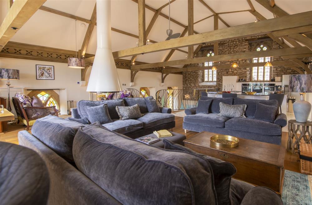 Cosy sitting area on the second floor with exposed brick work and beams at Askrigg Chapel, Askrigg, North Yorkshire
