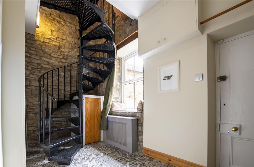 Spiral staircase leading from the first floor to the ground floor bedrooms and second kitchen at Askrigg Chapel, Askrigg, North Yorkshire