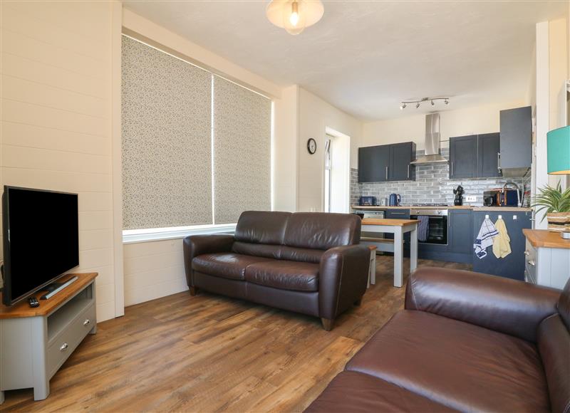 Relax in the living area at At the Bay Apartment, Hele Bay