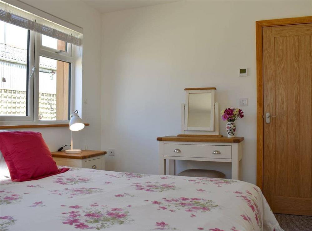 Comfortable double bedroom (photo 2) at Wisteria Cottage, 