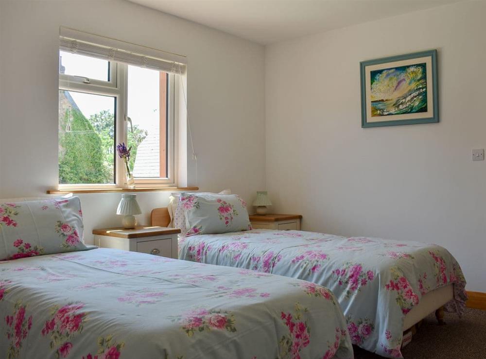 Comfy twin bedroom at Wisteria Cottage, 