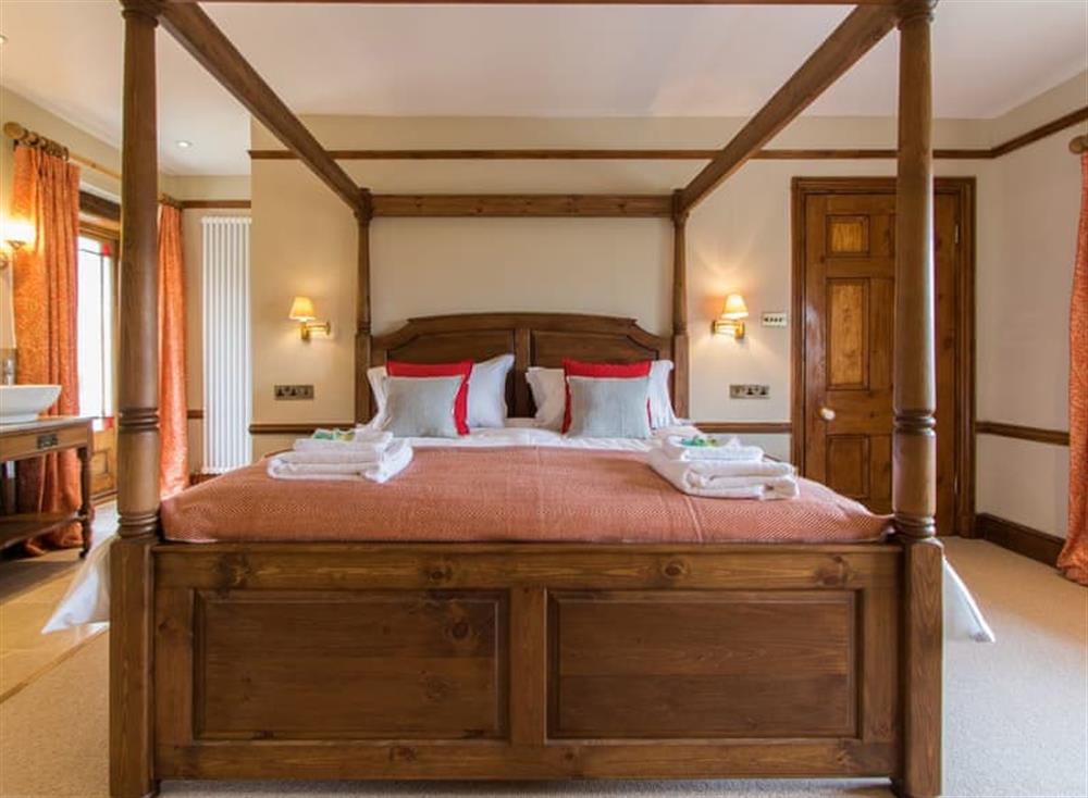 Four Poster bedroom at Atherstone Farm House in Atherstone, Somerset