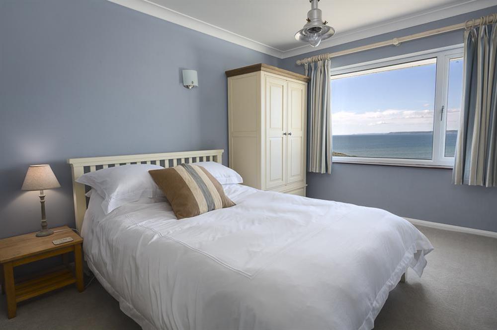 King-size bedroom with sea views at Atlantic Lodge in Hope Cove, Kingsbridge
