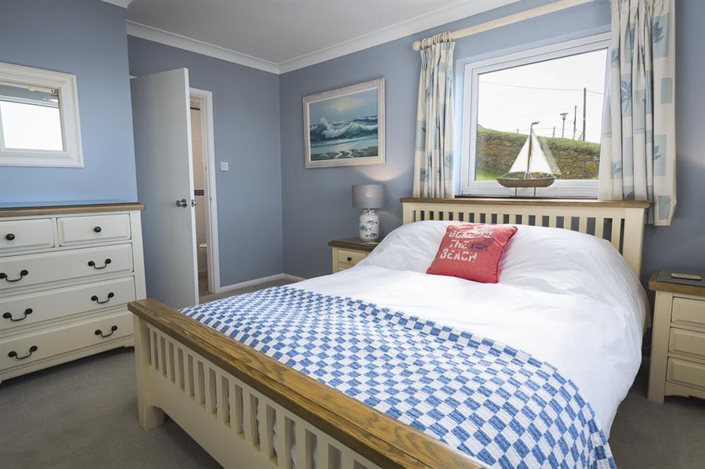 Master bedroom featuring King-size bed at Atlantic Lodge in Hope Cove, Kingsbridge