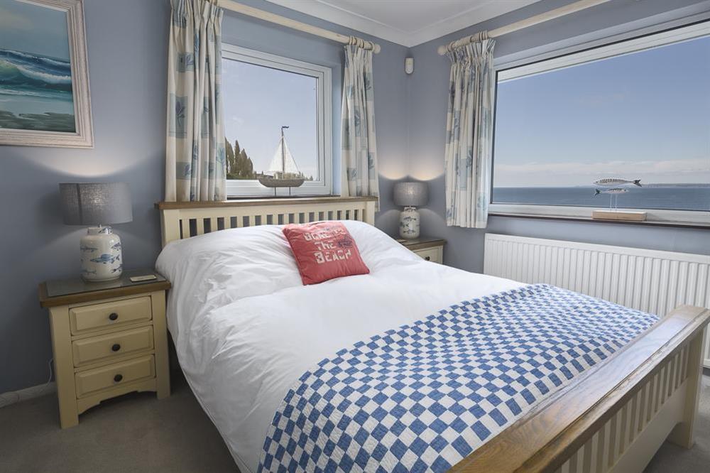 Master bedroom with sea views and en suite at Atlantic Lodge in Hope Cove, Kingsbridge