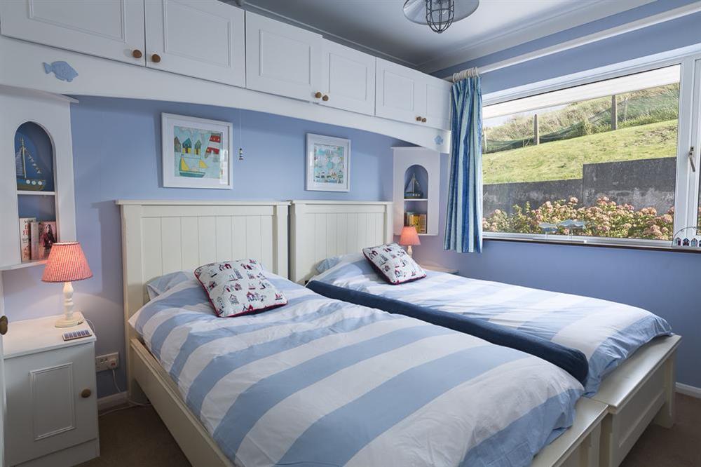 The second bedroom is a twin with two single beds at Atlantic Lodge in Hope Cove, Kingsbridge