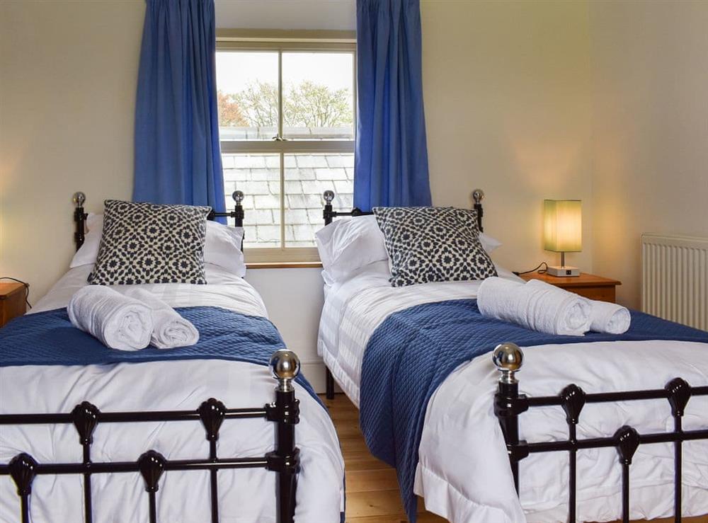 Twin bedroom at Atworthy Cross Cottage in Bradworthy, Devon