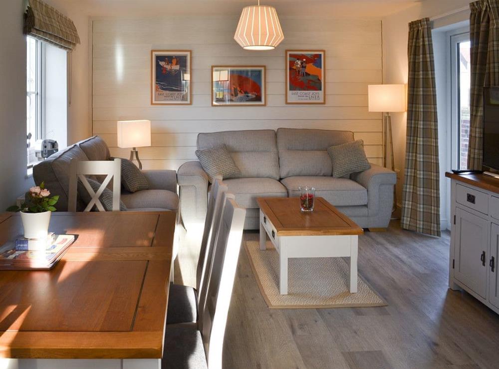 Open plan living space at Aubergine Cottage in Filey, near Scarborough, North Yorkshire