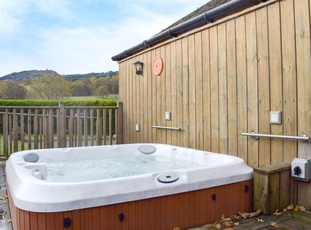 Relaxing private hot tub at Auchendennan Farm Cottage in Arden, Alexandria., Dumbartonshire