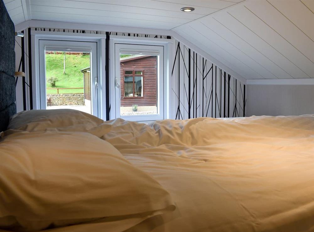 Galleried double bedroom at Beckside Cabin, 