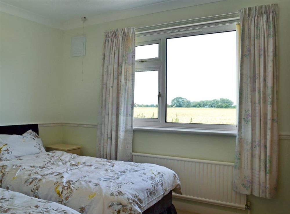 Charming twin bedroom at Authorpe Bungalow in Hogsthorpe, near Skegness, Lincolnshire