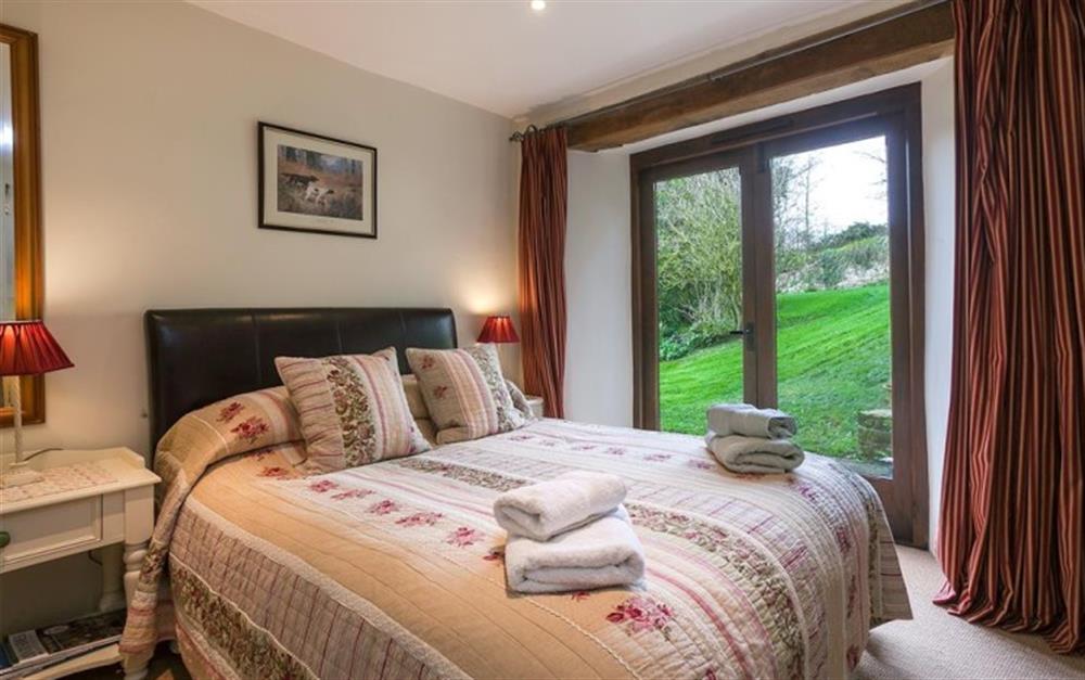 Bedroom 4 on ground floor with double bed at Auton Court in Kingsbridge