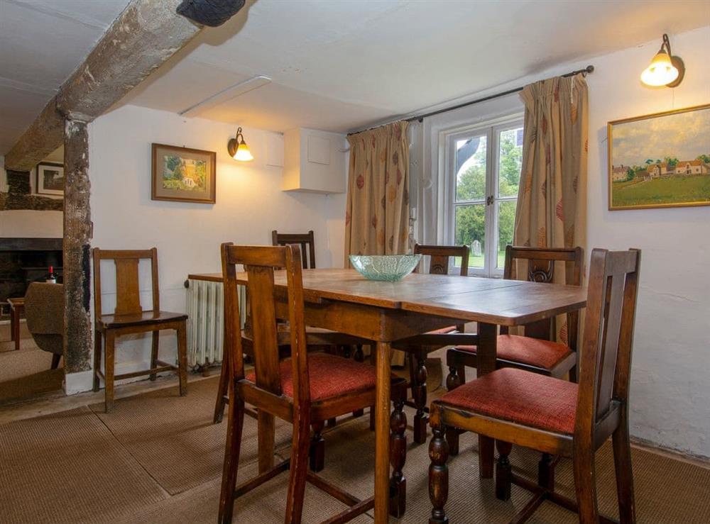 Dining room with beams and low ceiling (photo 2) at Avebury Cottage in Avebury, Wiltshire