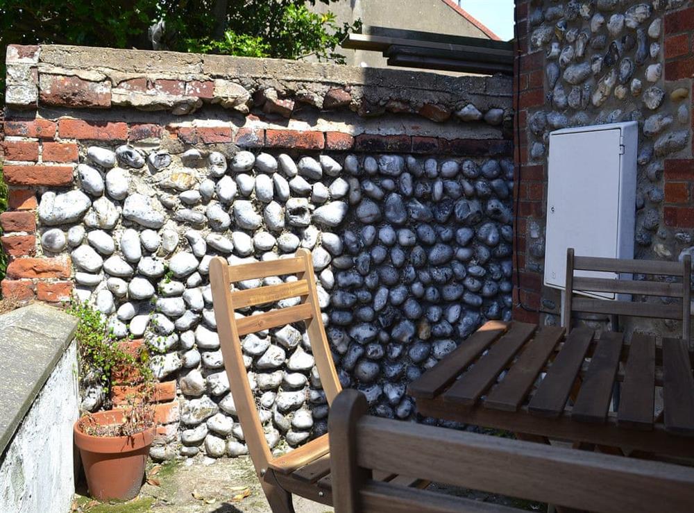 Modest outdoor eating/sitting area at Avocet Cottage in Sheringham, Norfolk