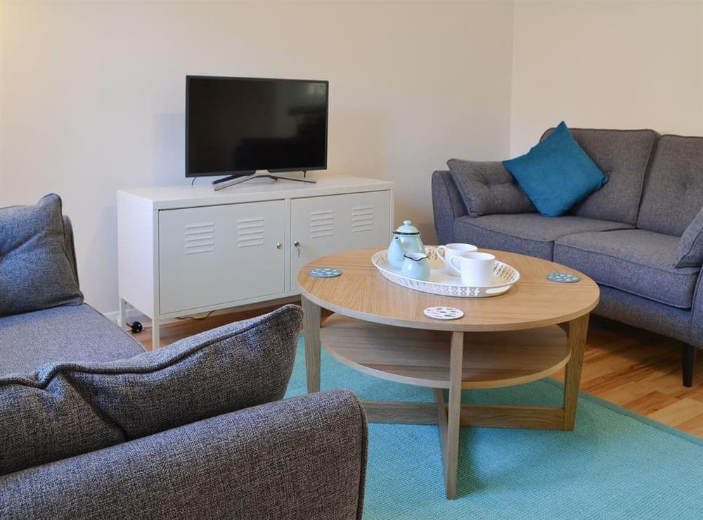 Relax and unwind in the living room at Avocet Cottage in Sheringham, Norfolk