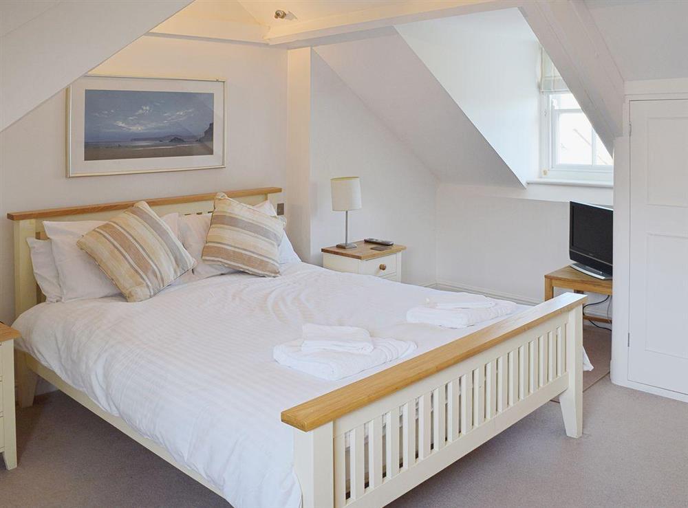 5 foot king size double bedroom  on second floor with dormer window at Avocet in Salcombe, Devon