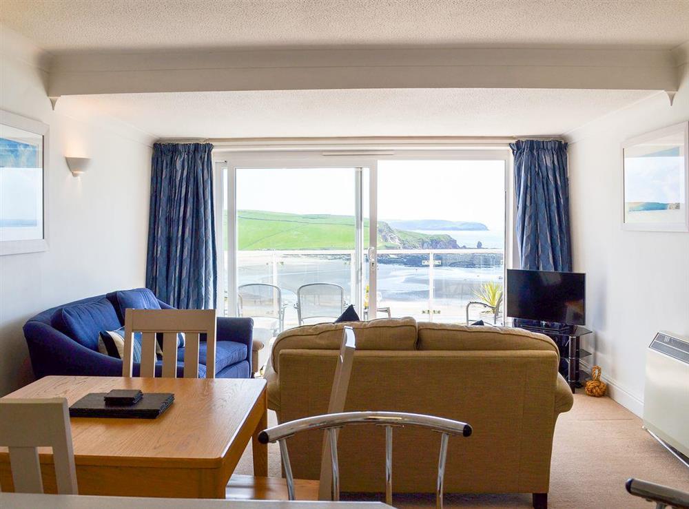 Spacious living area with sliding doors to private balcony at Avon Quillet in Bigbury-on-Sea, Devon