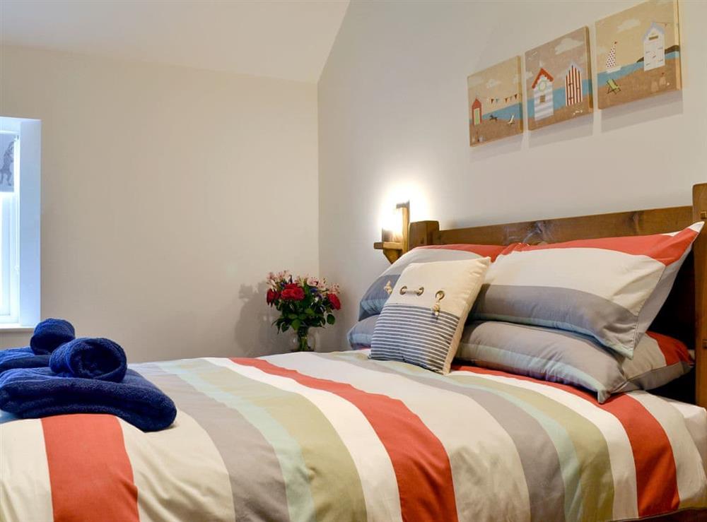 Relaxing double bedroom at Dringhoe Hall Cottages, 