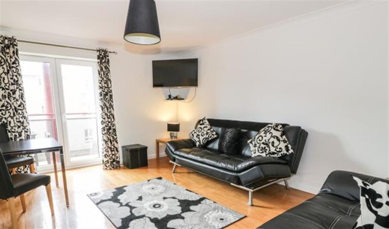Relax in the living area at Ayr Holiday Apartment, Ayr