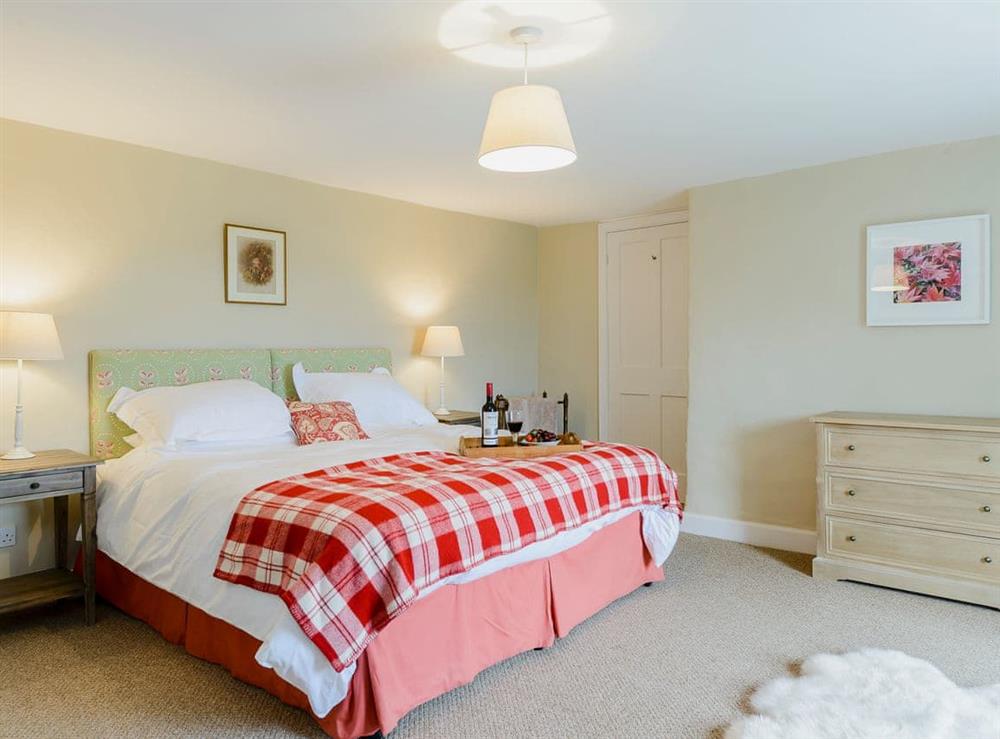 Attractive bedroom with super kingsize bed at Backstone Bank Farmhouse in Wolsingham, near Stanhope, Durham