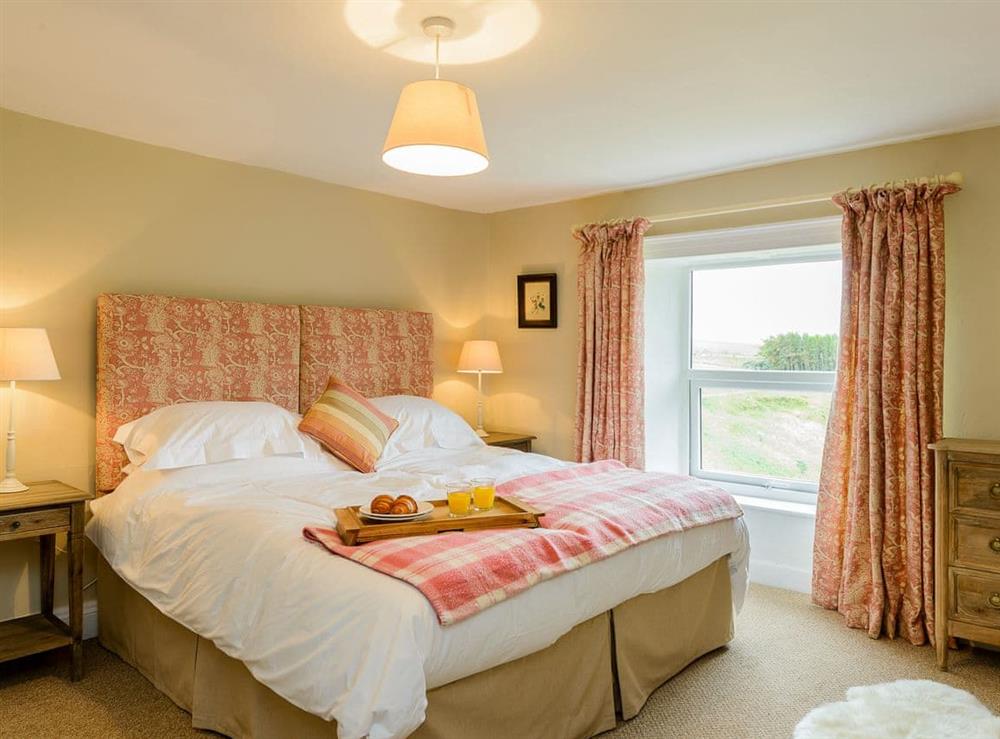 Serene bedroom with super kingsize bed at Backstone Bank Farmhouse in Wolsingham, near Stanhope, Durham