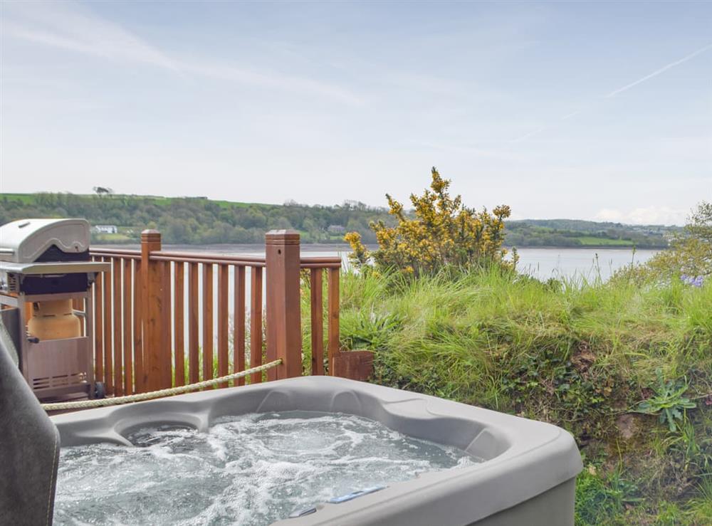 Hot tub at Badger Lodge in Burton, Dyfed