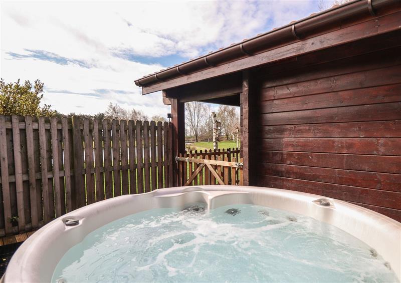 Enjoy the hot tub at Badger Lodge, Stainfield near Bardney