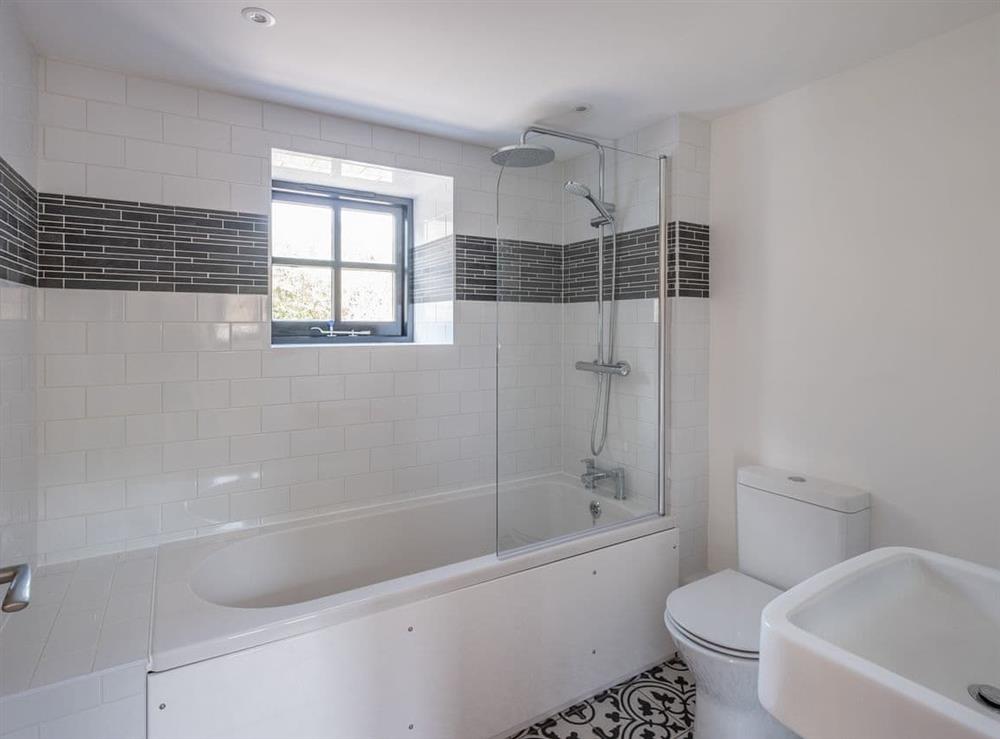 Bathroom with shower over bath at Badgers Brook in Brook, near Brighstone, Isle of Wight
