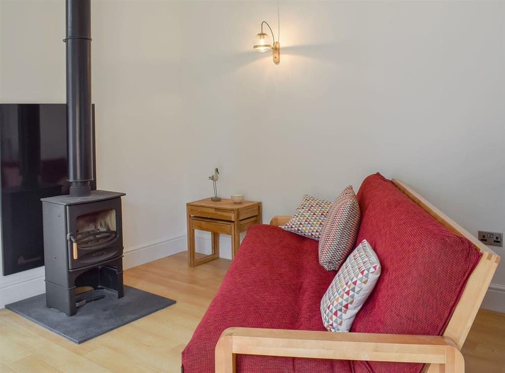 Spacious living area with wood burner at Badgers Brook in Brook, near Brighstone, Isle of Wight