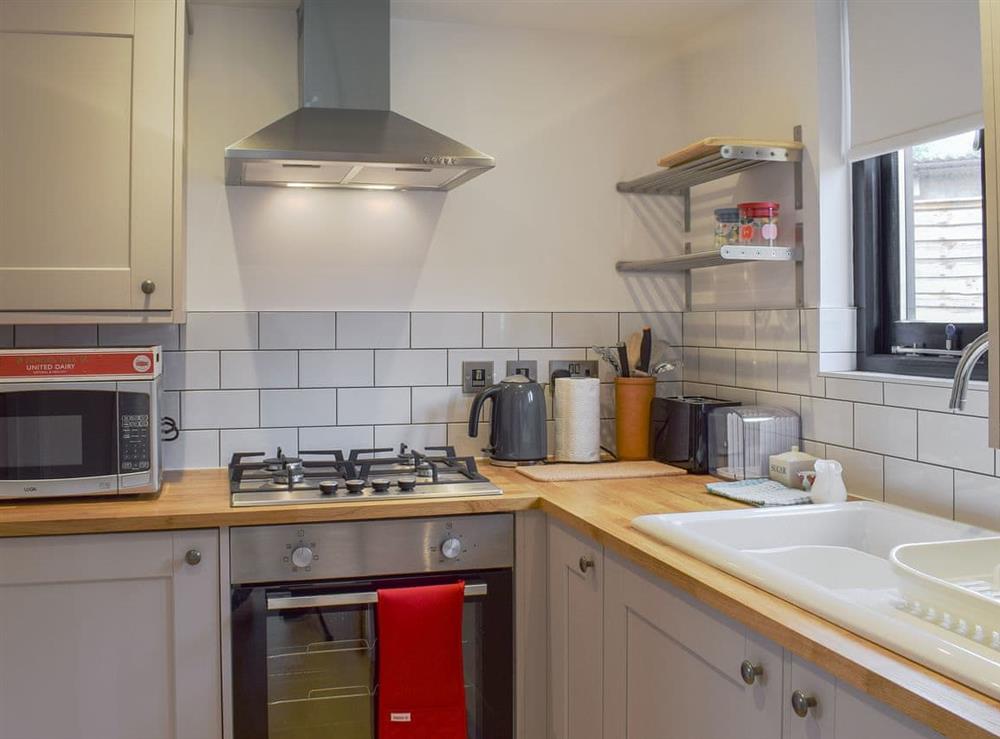 Well-equipped fitted kitchen at Badgers Brook in Brook, near Brighstone, Isle of Wight