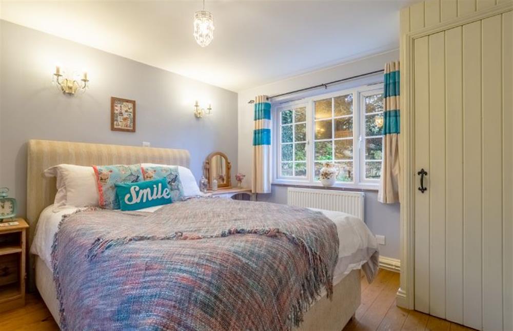 The bedroom has double bed at Badgers Den, Heacham near Kings Lynn