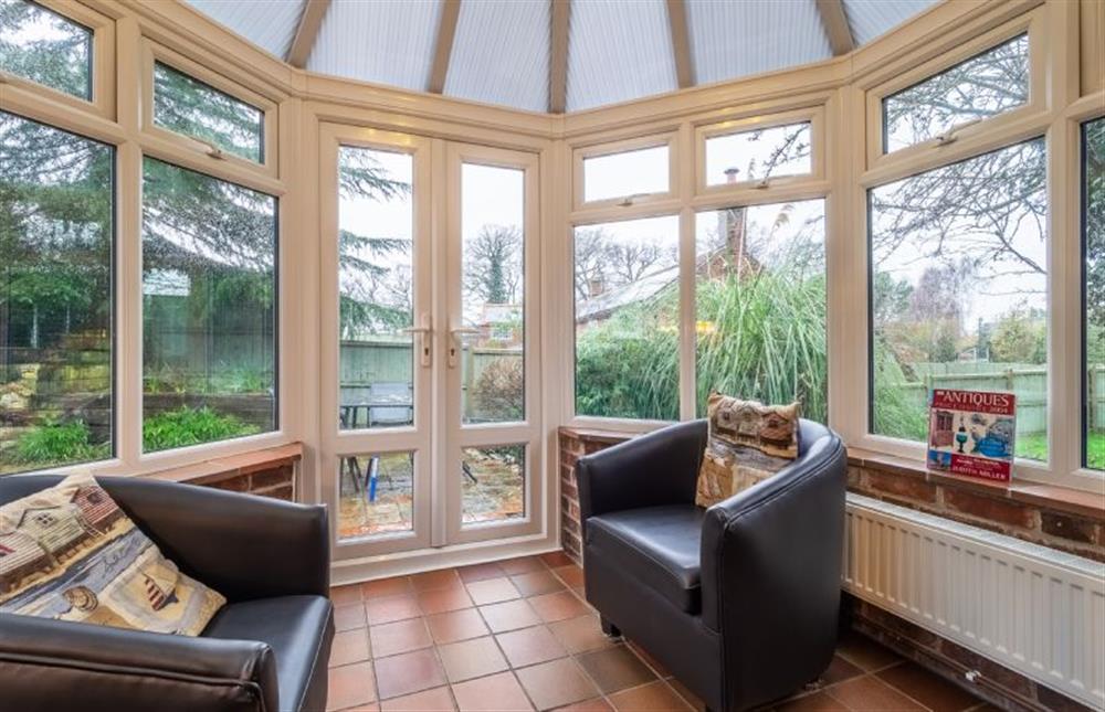 The conservatory is a peaceful spot to relax at Badgers Den, Heacham near Kings Lynn