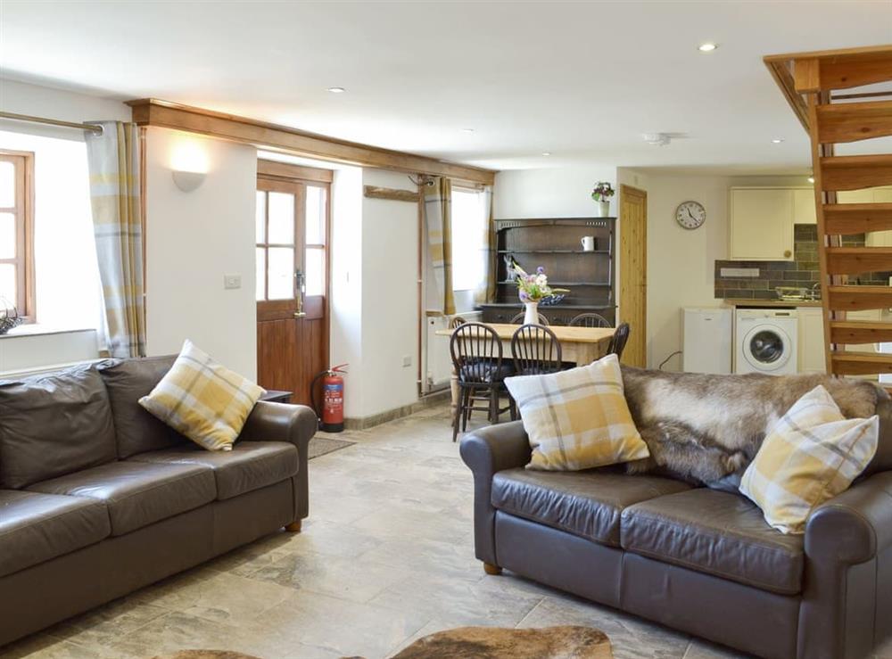 Convenient open-plan living space at Bagtor Hayloft in Islington, near Newton Abbot, Devon