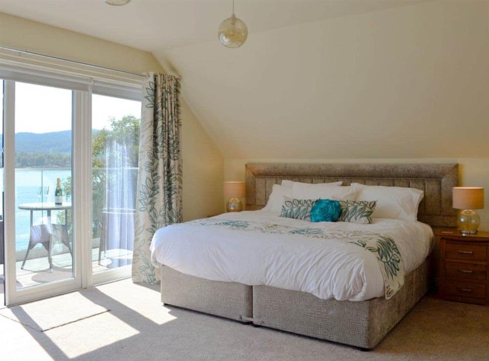 Spacious master bedroom with private balcony at Baileyfield in Strone, near Dunoon, Argyll
