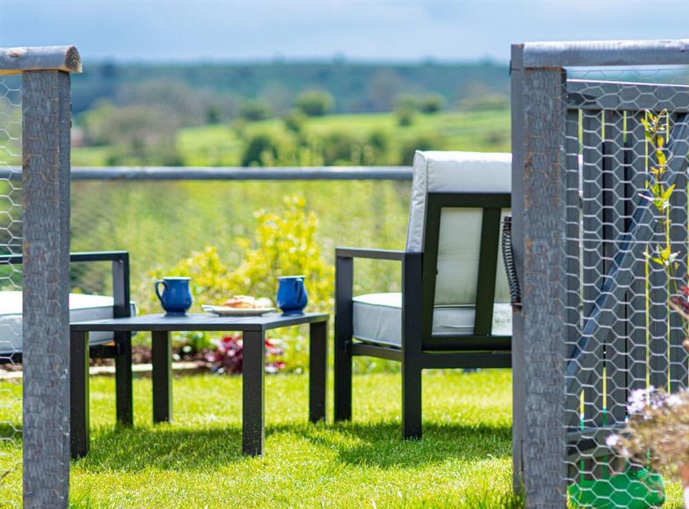 Beautiful new back garden, with spectacular views over the Peak District and comfortable lounge furniture at Baileys Barn in Bonsall, near Matlock, Derbyshire