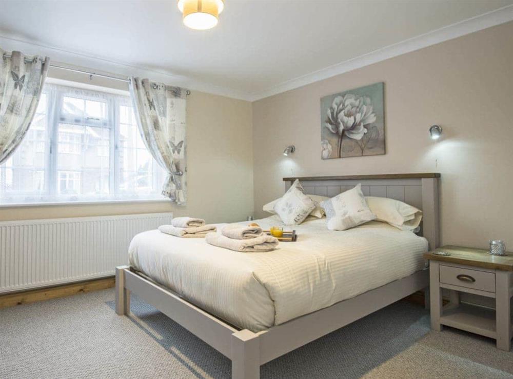 Stylishly furnished double bedroom with kingsize bed at Baileys Retreat in Bardney, near Lincoln, Lincolnshire, England