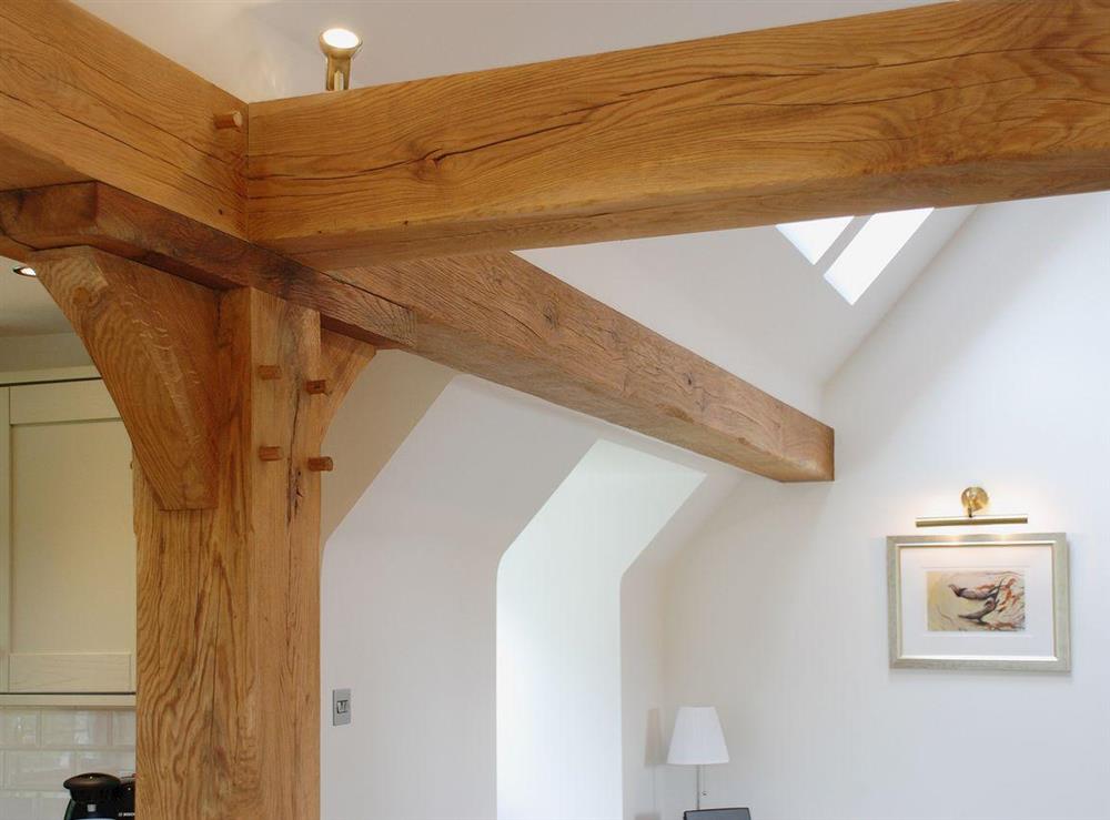 Exposed solid oak beams throughout lend a strength and beauty to the property