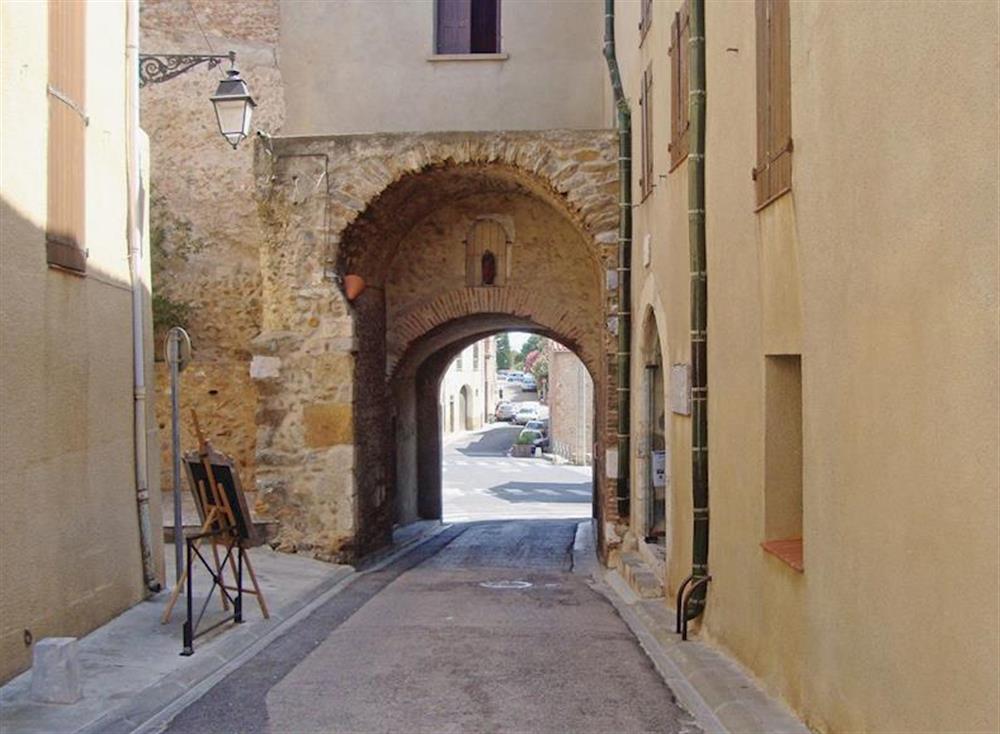 Accessed via a narrow archway, the honey-coloured apartment building is situated on a quiet side street