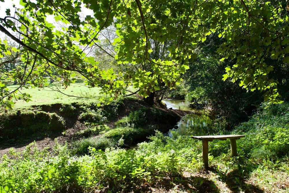 A perfect spot to watch the world go by down by the river at Bake House Cottage, Clifton Maybank, Nr Sherborne