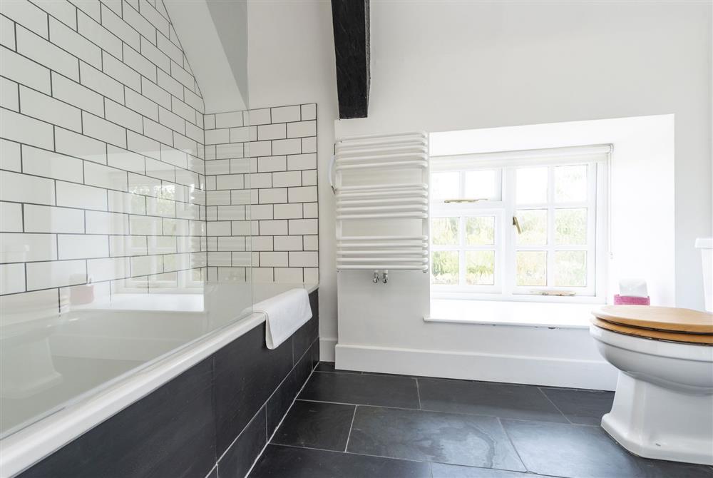 Family bathroom with bath and shower over at Bake House Cottage, Clifton Maybank, Nr Sherborne