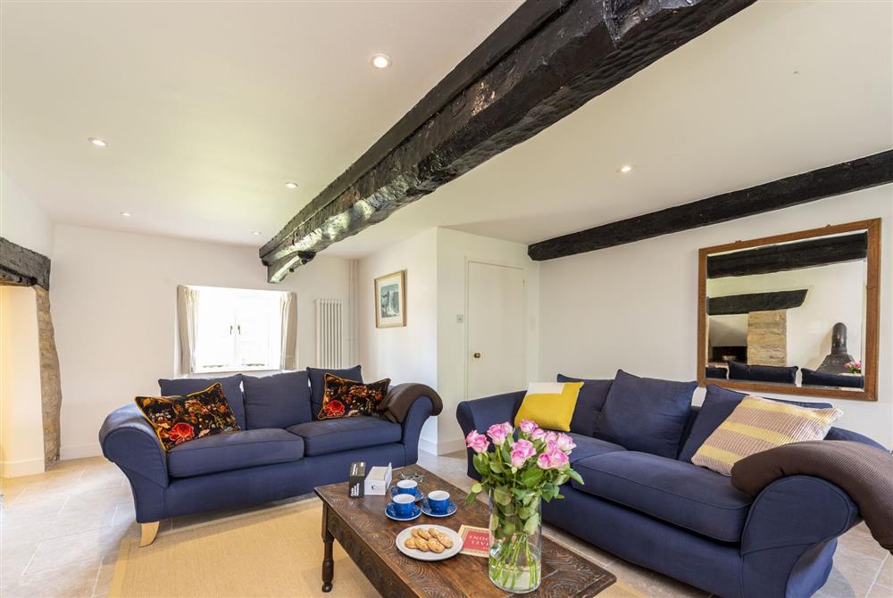 Sitting room with comfortable sofas at Bake House Cottage, Clifton Maybank, Nr Sherborne