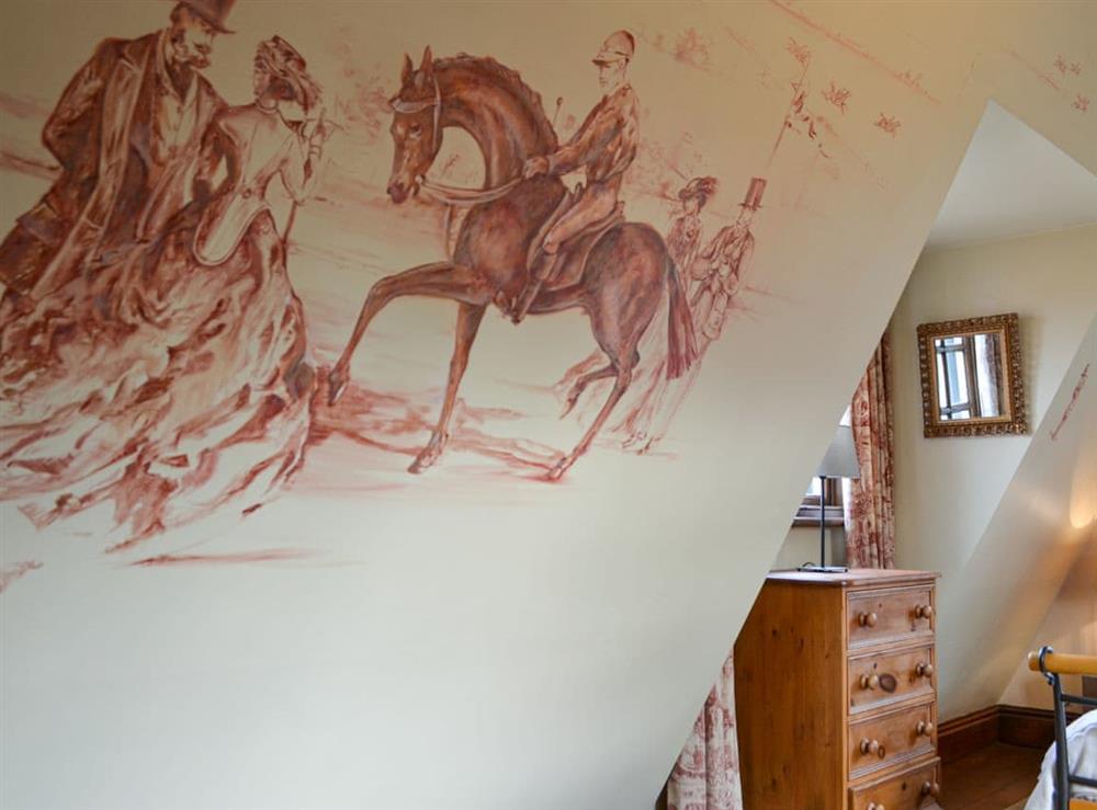 Double bedroom with hand-painted murals at Bakers Cottage in Hotham, near Beverley, North Yorkshire