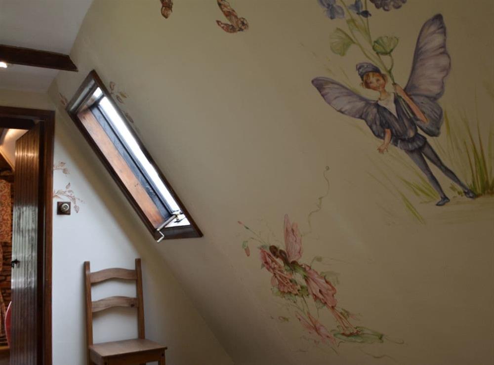 Hallway with hand-painted murals at Bakers Cottage in Hotham, near Beverley, North Yorkshire