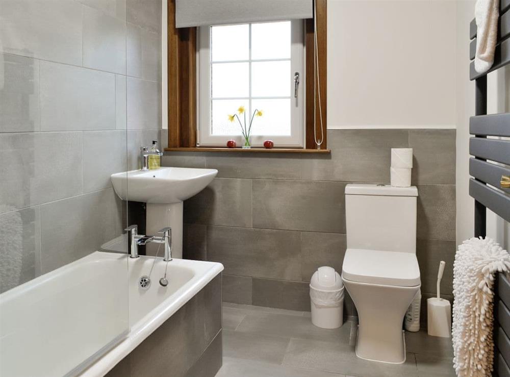 Family bathroom with shower over bath at Baldowrie Farm Cottage in Kettins, near Blairgowrie, Perthshire