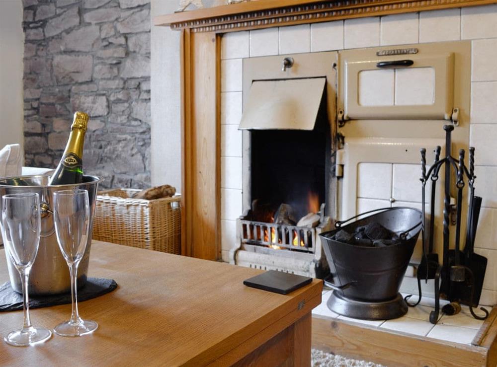Feature fireplace within the living room at Baldowrie Farm Cottage in Kettins, near Blairgowrie, Perthshire