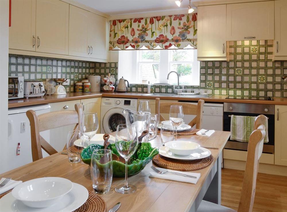Fully equipped kitchen with dining area at Baldowrie Gate Lodge in Kettins, near Blairgowrie, Perthshire